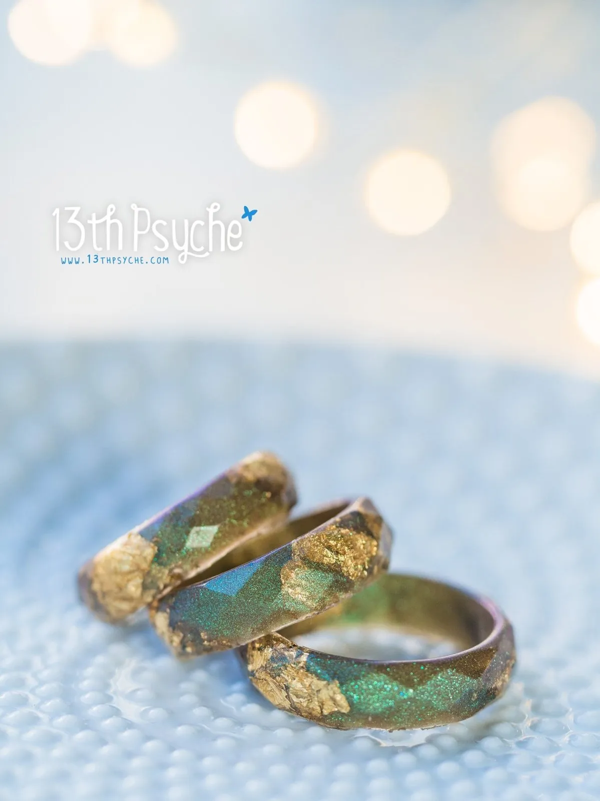 Iridescent green faceted resin ring with gold flakes