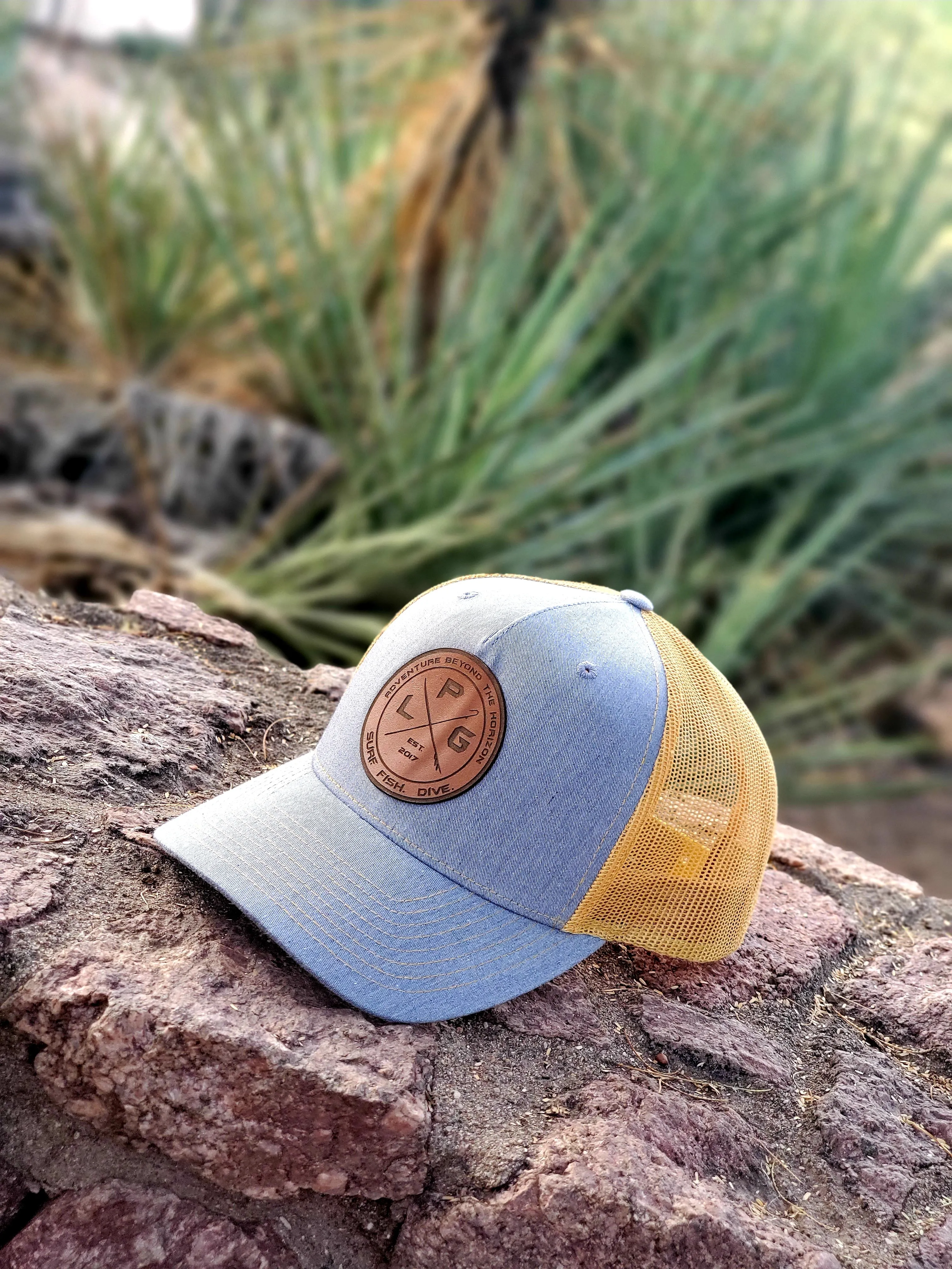 LPG Apparel Co. Crossed Gaff & Surfboard 112FP Heather Grey Amber Gold Snap Back Trucker Baseball Hat